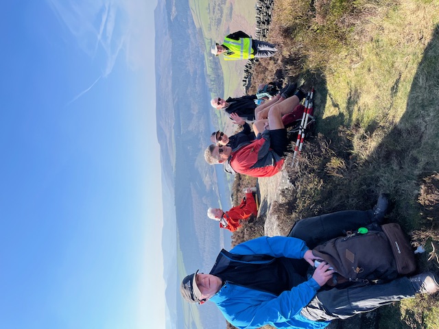Some of the group shown resting up a hill