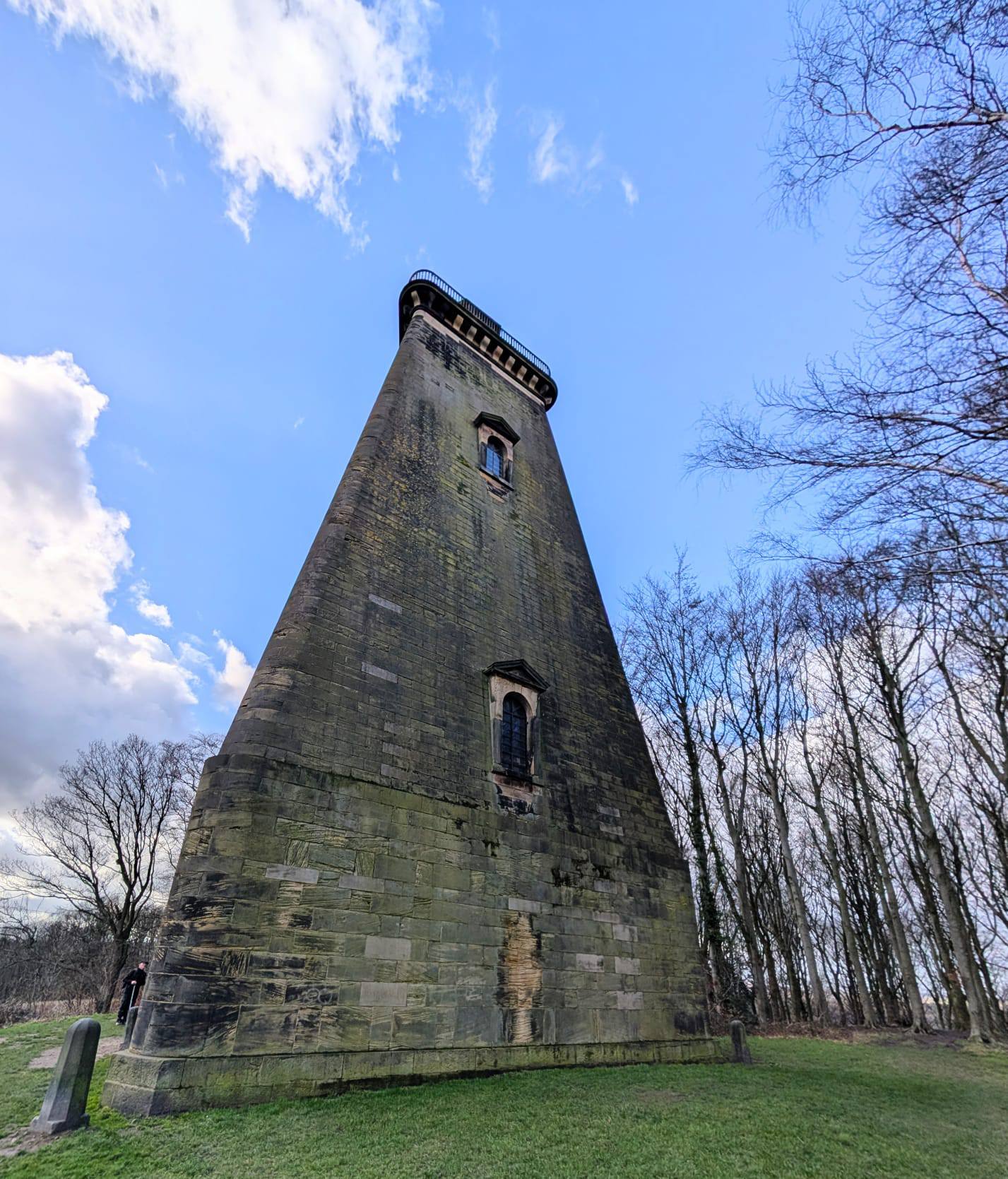 A photo of the Hoober Stand surrounded on one side by tall trees
